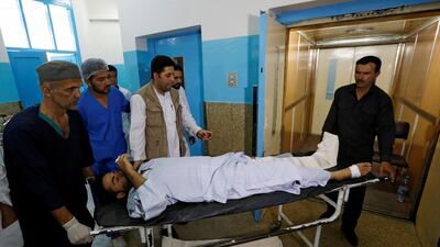 An injured man is carried inside a hospital after a suicide attack in Kabul, Afghanistan on August 29, 2017. Mohammad Ismail / Reuters