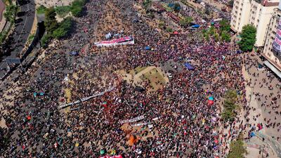An aerial view of a demonstration with a banner reading “We will overcome” commemorating the anniversary of the social uprising in Chile, in Santiago. AFP