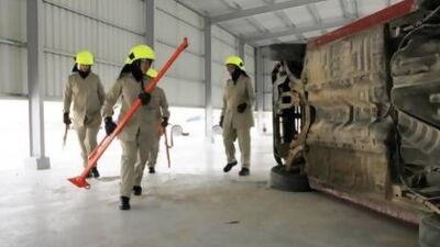 Abu Dhabi policewomen learn how to assist people trapped in vehicles following a crash.