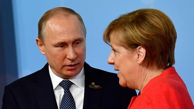 Mrs Merkel pictured with Mr Putin.
