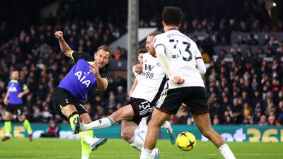 Harry Kane of Tottenham Hotspur has a shot whilst under pressure from Tim Ream of Fulham. Getty Images
