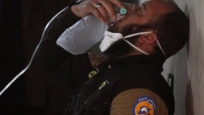 A civil defence member breathes through an oxygen mask, after a chemical attack on the rebel-held town of Khan Sheikhoun, Idlib province, on April 4, 2017. Ammar Abdullah / Reuters