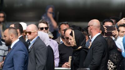 New Zealand Prime Minister Jacinda Ardern (C) attends a gathering for congregational Friday prayers and to observe two minutes of silence for victims of the twin mosque massacre, at Hagley Park in Christchurch on March 22, 2109. AFP