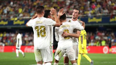 Gareth Bale of Real Madrid celebrates with team mates after scoring his sides first goal during the Liga match between Villarreal CF and Real Madrid CF at Estadio de la Ceramica, Villareal, Spain. Getty Images
