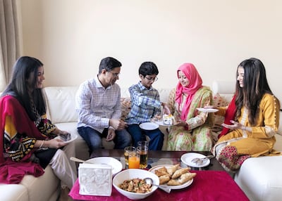 The Raza family reunited in time for Eid. Reem Mohammed / The National