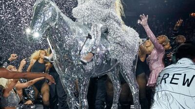 Sitting on a metallic horse, Beyonce wears a silver coat by Balmain and a catsuit by LaQuan. All photos: @beyonce / Instagram