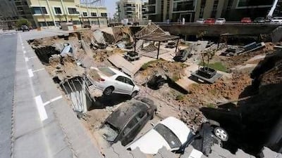 A huge concrete slab between three tower blocks of the development plunged one floor down into an underground car park. Courtesy of Al Ittihad
