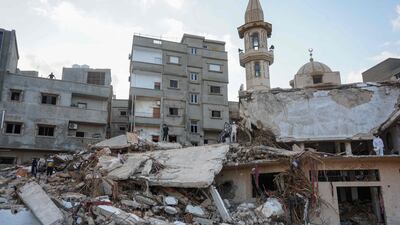 Building rubble and debris litter a street in Al Bayda town. AFP