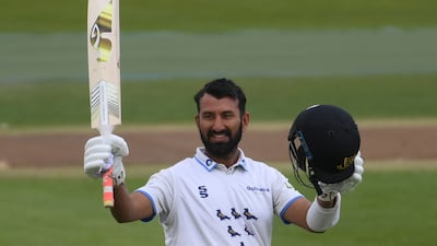 Cheteshwar Pujara of Sussex celebrates reaching his century on Friday. Getty
