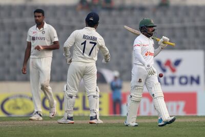 India's Ravichandran Ashwin, left, celebrates the dismissal of Bangladesh's top-scorer Mominul Haque. AP