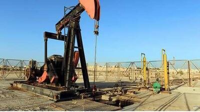 An oil pump or ''nodding donkey'' operates in the Awali region of Bahrain, on Wednesday, March 3, 2010. Bahrain's economy will grow 3.5 percent to 4 percent in 2010, keeping the same pace of expansion as last year, Finance Minister Ahmed Bin Mohammed Al-Khalifa told Al-Arabiya TV channel. Photographer: Phil Weymouth/Bloomberg *** Local Caption *** 641979.jpg