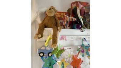 Hanging mobiles and lots of toys contibute to the fun environment in which Nat says she wants to raise her son.