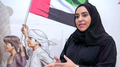 Huda Al Matroushi registers as an FNC member nominee in the Abu Dhabi Chamber of Commerce on Sunday. Victor Besa / The National