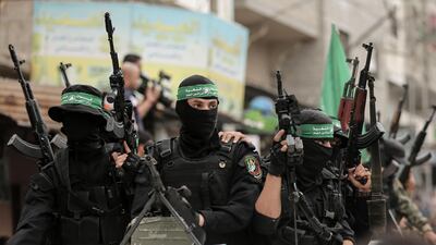 Members of the Islamist movement Hamas' military wing Al Qassam Brigades ride in vehicles in Deir Al Balah in the central Gaza strip on May 6, 2018. AFP