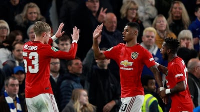 Manchester United's Marcus Rashford, centre, celebrates after scoring the opening goal. AP