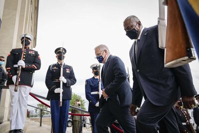 Australian Prime Minister Scott Morrison and US Defence Secretary Lloyd Austin walk past a military honour guard prior to their meeting at the Pentagon last September. AFP