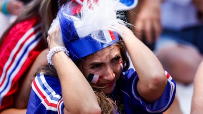 France supporters struggle to watch as their side fall to defeat against Spain, at a viewing party in Los Angeles. EPA
