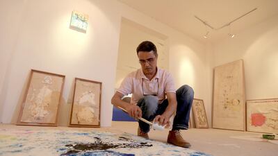 Mohammed Quraish, a resident artist from Canada working with paper, iron and ink at Art Hub Liwa. Ravindranath K / The National