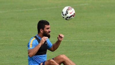 New Barcelona signing Arda Turan heads the ball during a training session at the StubHub Center, home of the LA Galaxy, on Monday. Mark Ralston / AFP