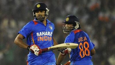 Rohit Sharma, left, and Ravindra Jadeja were involved in an 83-run partnership against West Indies on Tuesday night.