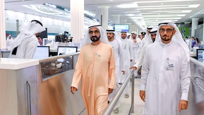 Sheikh Mohammed leads his delegation through passport control. Wam