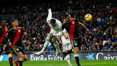 Real Madrid defender Sergio Ramos heads at goal. Reuters