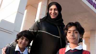 Hifa Al Ansari with her children Khalid, 7, left, and Salah, 9.