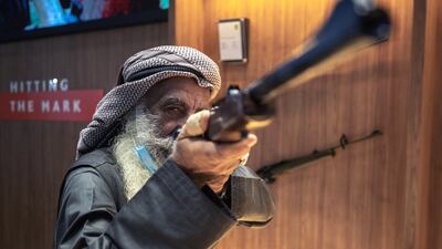 Marksman Ali Mohammat Al Shehhi tests his aim at Adihex. Victor Besa / The National