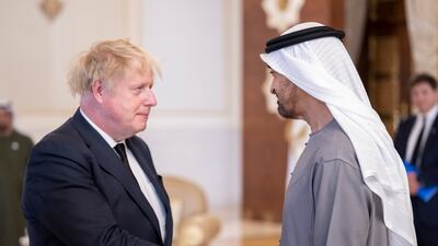 UK Prime Minister Boris Johnson speaks with Sheikh Mohamed. Abdulla Al Junaibi for the Ministry of Presidential Affairs