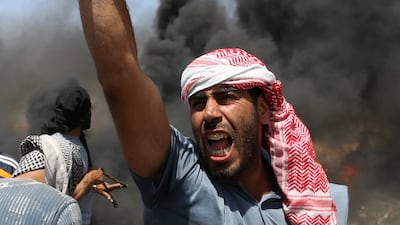 A demonstrator shouts during the protest. Ibraheem Abu Mustafa / Reuters