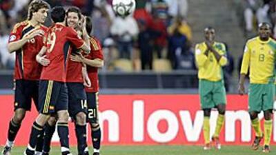 Xabi Alonso is surrounded by his Spain teammates after his free kick in extra time earned his country a 3-2 victory over South Africa to claim third place at the Confederations Cup.