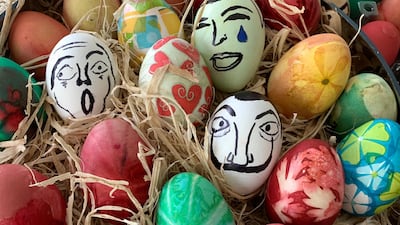 Use Sharpie pens to draw faces on your eggs; I tried my hand at Dali, in the centre