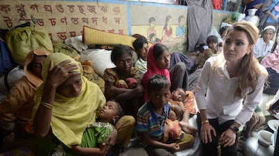 Jordan's Queen Rania sits with Rohingya refugees during her visit to the Kutupalong refugee camp in Ukhia. Tauseef Mustafa / AFP Photo