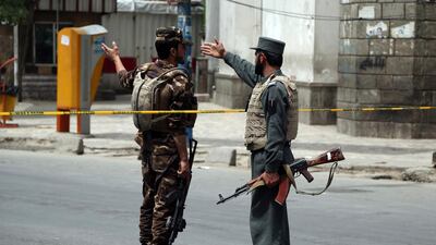 Afghan security personnel attend the site of a huge explosion in Kabul, Afghanistan. AP Photo