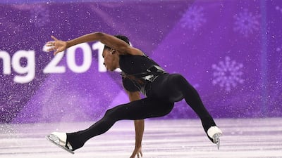 France's Vanessa James falls as she and partner France's Morgan Cipres compete in the pair skating free skating of the figure skating event. Aris Messinis / AFP