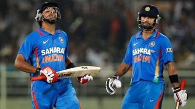 India's Virat Kohli, right, and Rohit Sharma put on a match-winning 163-run partnership against West Indies at Visakhapatnam on Friday night.