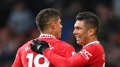 Raphael Varane celebrates with Manchester United teammate Casemiro. Getty