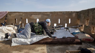 A YPG fighter takes position at the frontline near Hasakah, Syria. Getty Images