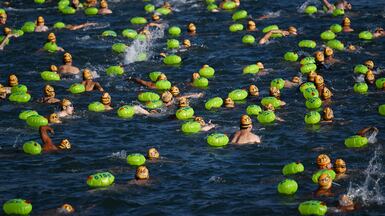 Swimmers cross Hong Kong's Victoria Harbour, during the Harbour Race. More than 3,700 people from around the world took part in this year's event. AFP
