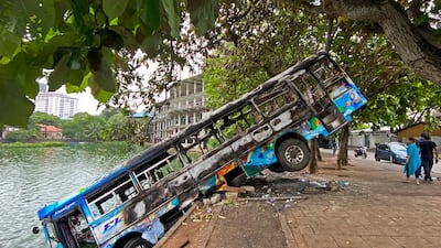 A burnt bus near Sri Lanka's former prime minister Mahinda Rajapaksa's official residence, a day after it was torched by protesters in Colombo. AFP