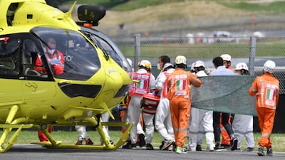 Medical officers evacuate Swiss Moto3 rider Jason Dupasquier after a crash during a qualifying session of the Italian Grand Prix at the Mugello race track on Saturday. Dupasquier later succumbed to his injuries on Sunday. AFP