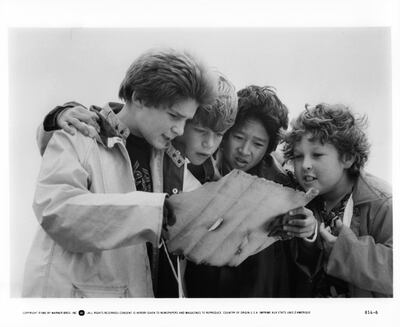 From left , Corey Feldman, Sean Astin, Ke Huy Quan and Jeff Cohen read a treasure map in a scene from The Goonies in 1985. Warner Brothers / Getty Images