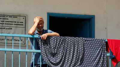 A Palestinian man, who fled his home due to Israeli air and artillery strikes stands at a United Nations-run school where he takes refuge, in Gaza City May 18. Reuters