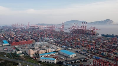 A container ship docks at the Yangshan port in Shanghai. a trade war could knock China's economic plans off kilter. AP Photo