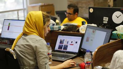 Employees of Tehran-based e-commerce site Bamilo. The company's app was among a number pulled by Apple from its App Store. Atta Kenare / AFP