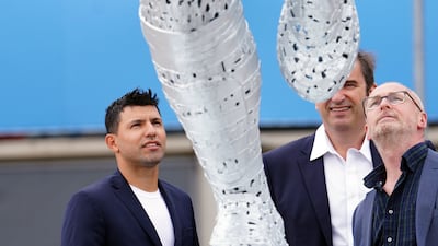 Manchester City's record scorer Sergio Aguero with sculptor Andy Scott during his statue unveiling outside the Etihad Stadium. AP