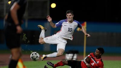 United States star Christian Pulisic, left, will not be showcasing his talent in Russia. Rebecca Blackwell / AP Photo