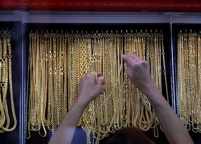 Gold prices have fallen more than 14 per cent in the past month. EPA