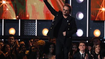 Bono presents the award for album of the year. Lucas Jackson / Reuters