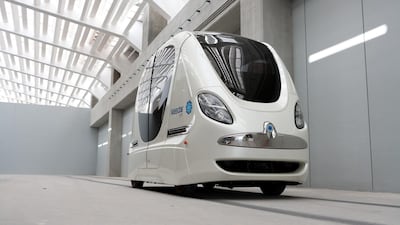 A Personal Rapid Transit (PRT) vehicle, or driverless electric pod car, transports students between parking areas and Masdar Institute of Science and Technology in Abu Dhabi. Duncan Chard / Bloomberg